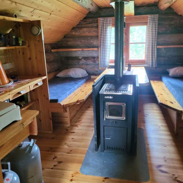 The cabin is heated with a stove